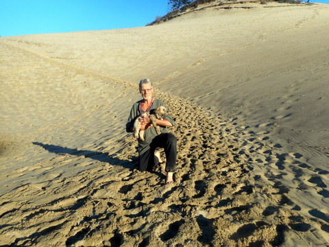 Our dog feeding guidelines include exercise on this sunny Oregon beach!